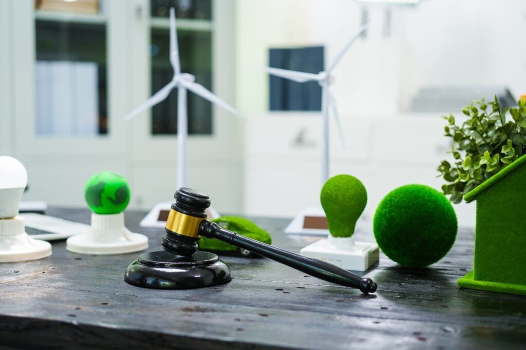 A table holds documents on environmental laws,clean energy, wind turbines,eco-friendly homes.focus