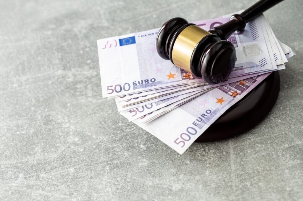 Euro banknotes and judge gavel.